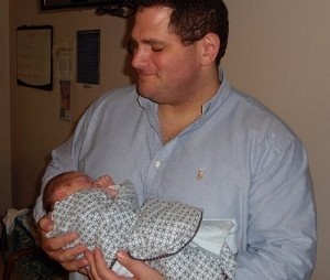 Holding friends baby               